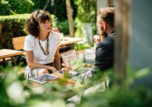 Restaurant owner sitting with accountant discussing restaurant accounting and tax